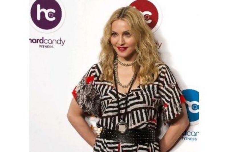 Madonna at the opening of her new gym - an all-singing, all-dancing place where classes are as important as the state-of-the-art equipment.