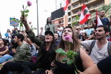 Lebanese actress and film director Nadine Labaki (centre) with fellow demonstrators in the second week of anti-government protest in the centre of Beirut on October 26. AFP