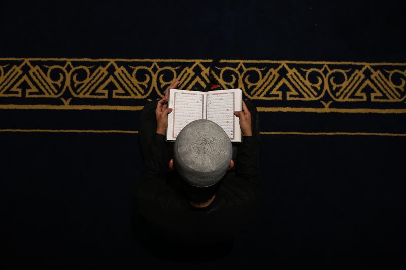 A Muslim believer reads the Quran in Cairo's Al Azhar mosque. AFP