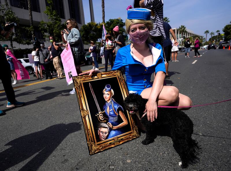 Britney Spears supporter and artist Never Tara of Los Angeles displays her painting outside the Stanley Mosk Courthouse on September 29, 2021. AP