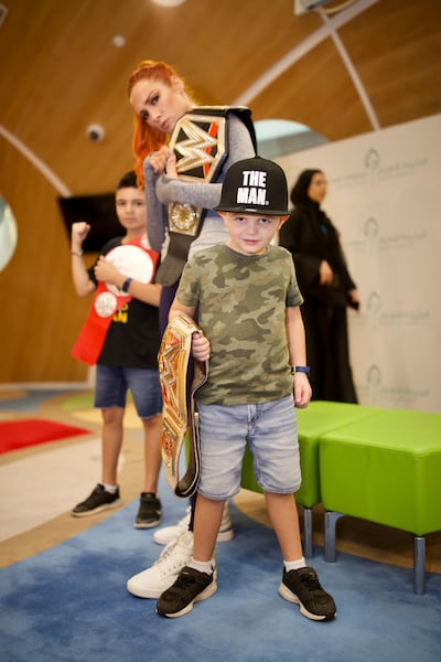 WWE Raw Women's champion Becky Lynch poses with young fans. Courtesy Dubai Fitness Challenge