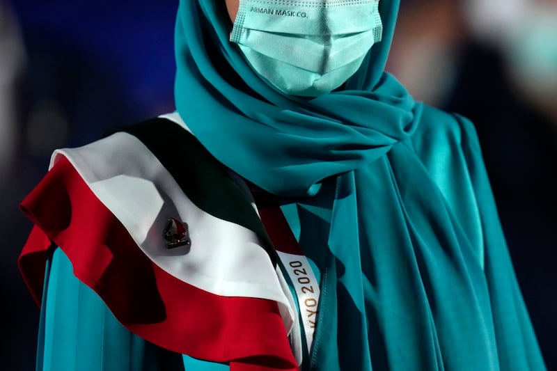 A team member of Iran walks during the opening ceremony in the Olympic Stadium at the 2020 Summer Olympics.