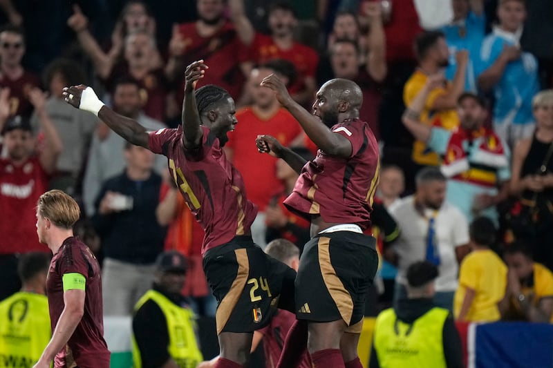 Belgium's Romelu Lukaku, right, celebrates with his teammate Amadou Onana. AP