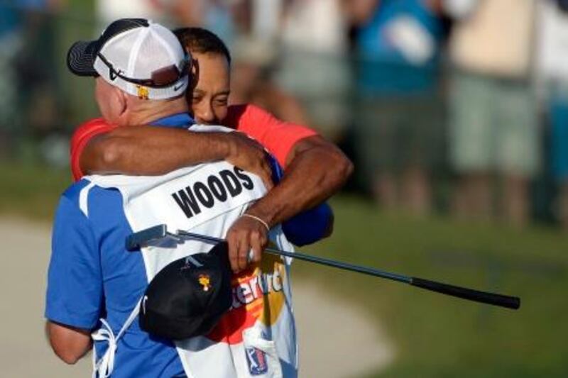 Tiger Woods, rear, embraces his caddie Joe LaCava after winning the Arnold Palmer Invitational golf tournament at Bay Hill in Orlando, Fla., Sunday, March 25, 2012.(AP Photo/Phelan M. Ebenhack) *** Local Caption ***  Bay Hill Golf.JPEG-0f211.jpg