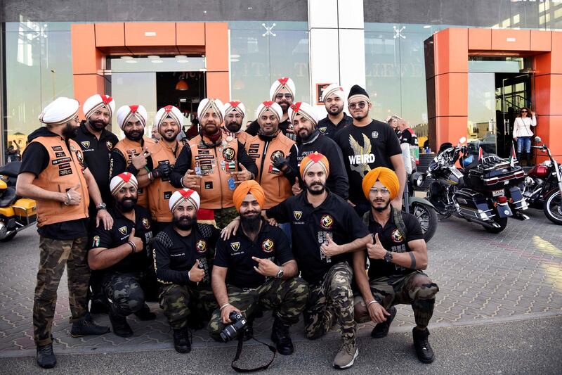 Gurnam Singh, center, founder of the Sikh Bikers group along with other members pose for a photograph outside the Harley Davidson showroom during the 48th National Rally "Love Zayed" in Sharjah, UAE, Friday, Nov. 29, 2019. Shruti Jain The National