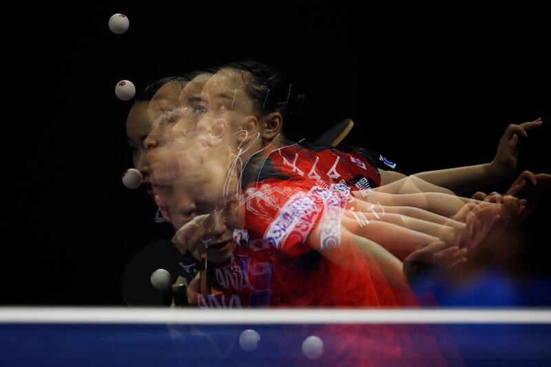 A multiple exposure picture shows Mima Ito of Japan competing against Yuting Gu of China during the women's singles at the International Table Tennis Federation, World Tour Platinum Korean Open in Daejeon, South Korea. Jeon Heon-Kyun / EPA