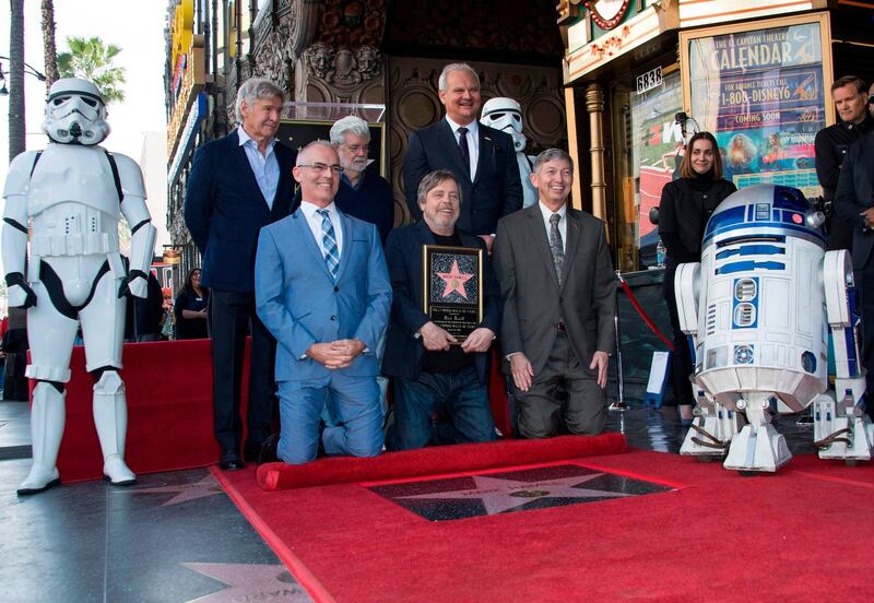From top left: Harrison Ford, George Lucas, Mark Hamill (bottom centre), and Hollywood Chamber of Commerce, President/CEO Leron Gubler (bottom right), and guests attend the Hollywood Walk of Fame, AFP