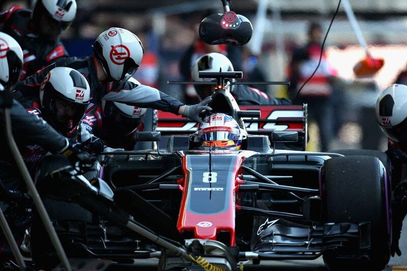 Romain Grosjean is shown in the the Haas F1 Team Haas-Ferrari VF-17 Ferrari during a pit stop during the final day of Formula One winter testing at Circuit de Catalunya on March 10, 2017 in Montmelo, Spain.  Charles Coates / Getty Images
