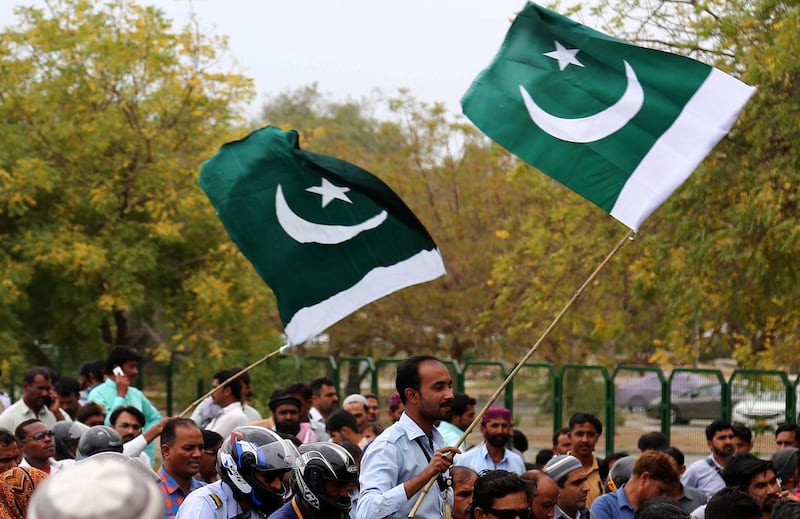 epa07405989 Passengers hold national flags as they arrive at the airport to take their flights, after Pakistan resumed the flight operations and partially opened its airspace, at Jinnah International Airport in Karachi, Pakistan, 01 March 2019. Pakistan closed the airspace and India also shut down its airports in the northern region briefly after the two South Asian nuclear powers claimed on 27 February to have shot down each others fighter planes in cross-border aerial strikes in the disputed Kashmir region.  EPA/SHAHZAIB AKBER