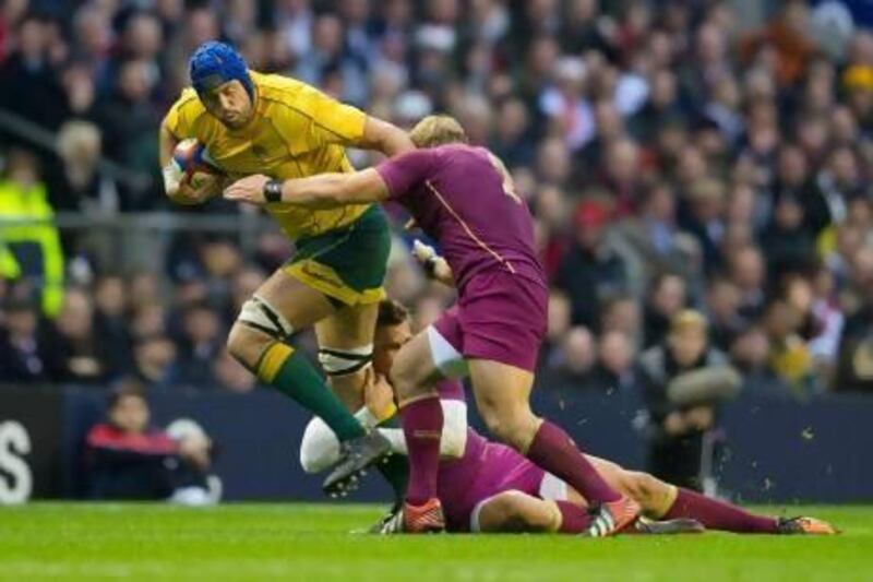 England, in purple, were beaten by Australia last week which could affect their ranking. Tom Hevezi / AP Photo