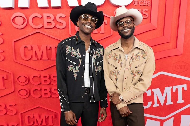 Musicians Torrence Thomas, left, and Thurman Thomas III of Thebrosfresh sporting country looks. AFP