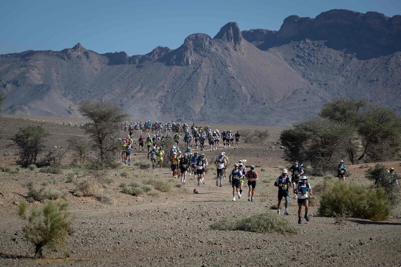 Stage 1, Timgaline to Ouest Aguenoun n'Oumerhiout, with the runners pacing themselves to avoid early burn-out.