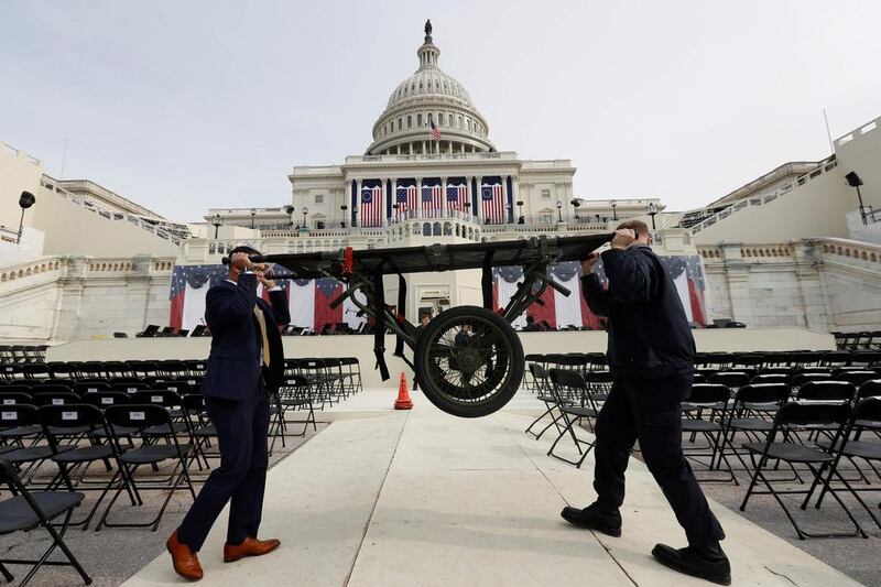 Workers prepare for the inauguration of US president-elect Donald Trump at the US Capitol in Washington, DC, on January 19, 2017. Brian Snyder / Reuters