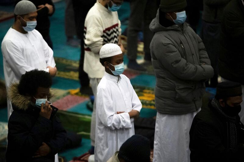 People pray at the East London Mosque Muslim Centre, UK. AP Photo