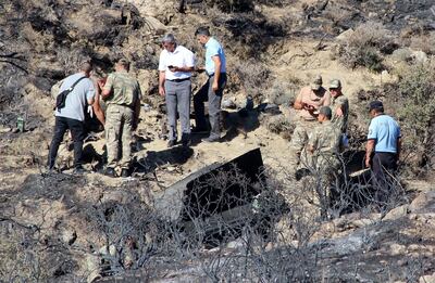 epa07687026 Soldiers of the Turkish army and northern Cypriot forces inspect the site where a missile allegedly fired from Syria landed overnight in the Turkish occupied north village of Tashkent (also known as Vouno), Cyprus, 01 July 2019. According to media reports, a Syrian anti-aircraft missile that missed its target landed in North Cyprus. No causalities reported in the incident. The missile is believed to have been launched to intercept alleged Israeli airstrikes.  EPA/YENIDUZEN