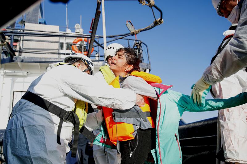 Migrants are rescued by crew members of the 'Abeille Languedoc' ship after their boat's generator broke down in French waters as they were trying to cross the Channel illegally to Britain. All photos: AFP