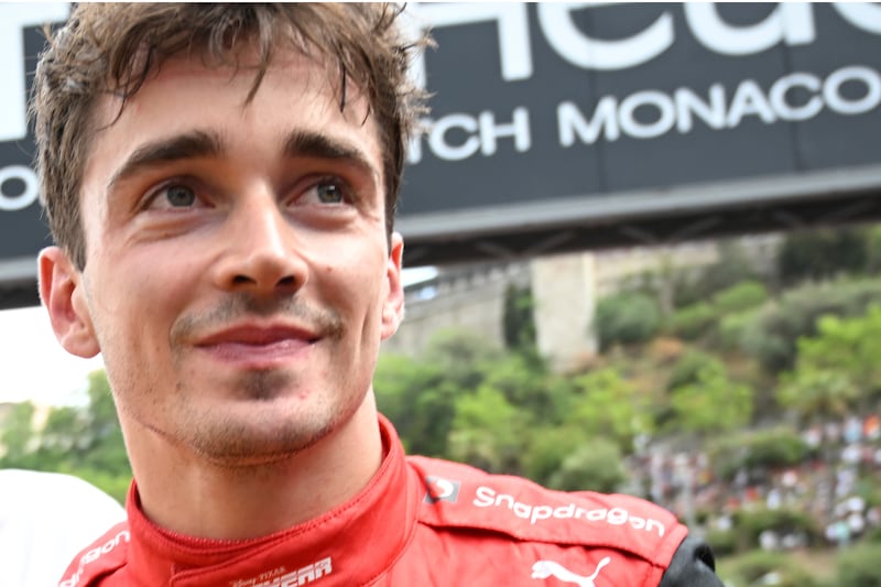Ferrari's Charles Leclerc of Monaco smiles after securing pole position. AP