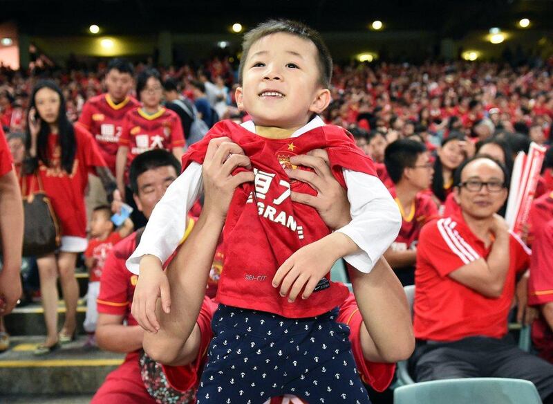 Guangzhou Evergrande fans watch their players warm up before the start of their AFC Champions League group stage football match against Sydney FC, in Sydney on March 2, 2016. AFP