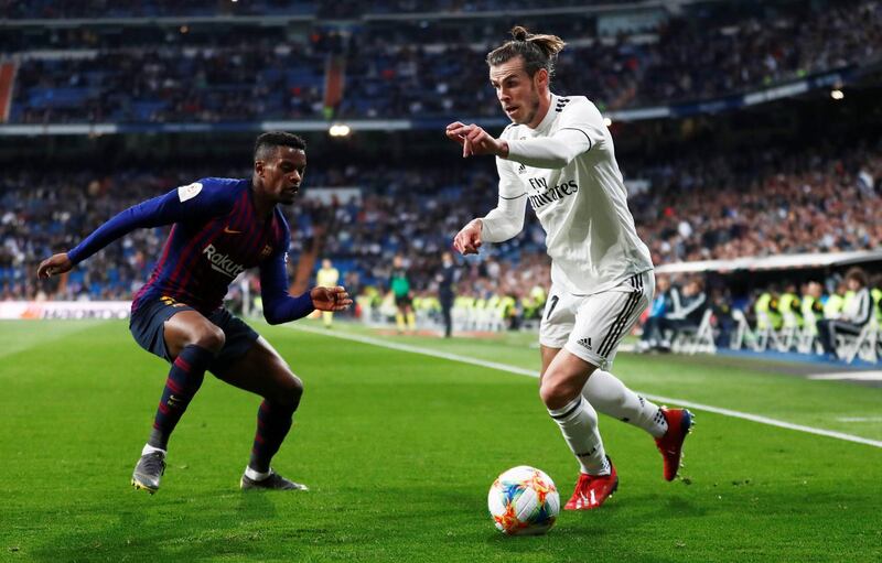 Real Madrid's Gareth Bale in action with Barcelona's Nelson Semedo. Reuters