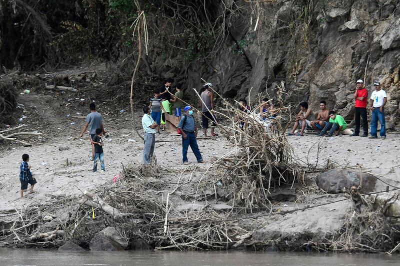 People wait to cross the Ulua river to evacuate from San Rafael colony before the arrival of hurricane Iota. Getty