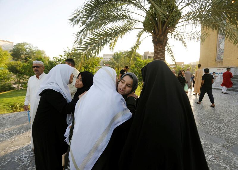 Worshippers exchange greetings after Eid Al Fitr prayers marking the end of the fasting month of Ramadan, at a mosque in Baghdad, Iraq. Reuters