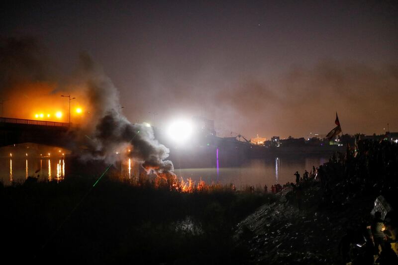 Smoke rises during ongoing anti-government protests in Baghdad. Reuters