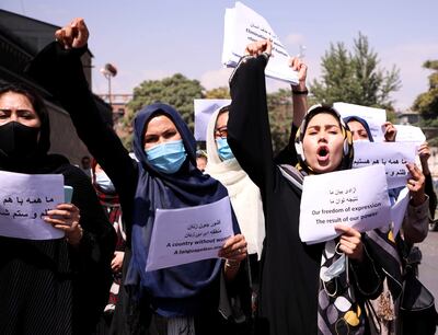 Afghan women's rights defenders and civil activists protest to call on the Taliban for the preservation of their achievements and education, in front of the presidential palace in Kabul, Afghanistan. Reuters