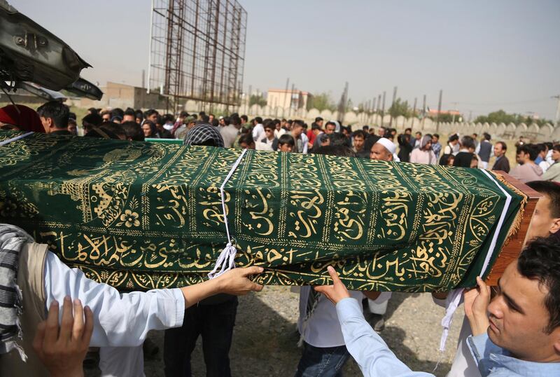 Men carry the coffin of a relative who died in Wednesday's deadly suicide bombing. AP