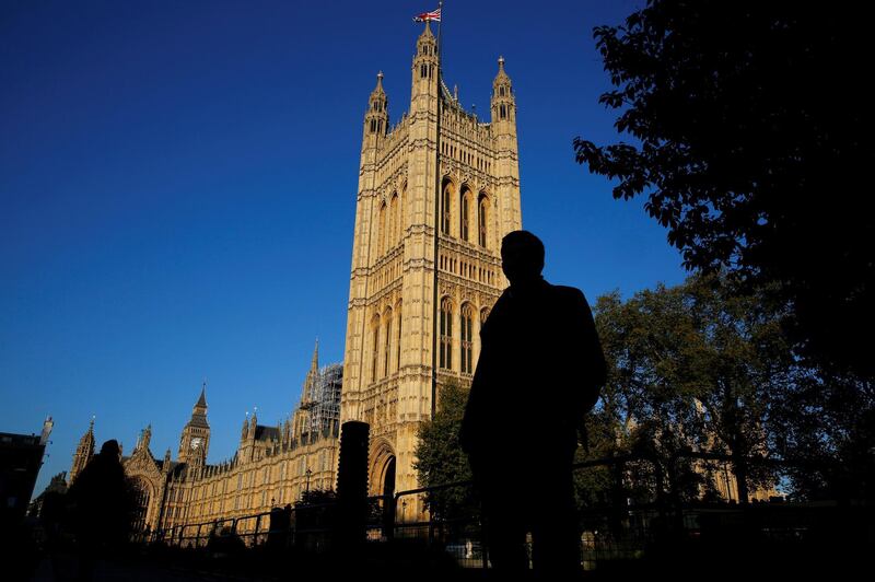 FILE PHOTO: People are silhouetted against the Houses of Parliament in central London, Britain October 26, 2015. REUTERS/Stefan Wermuth/File Photo