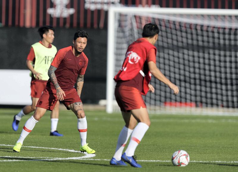 Abu Dhabi, United Arab Emirates - January 03, 2019: Zhang Lin Peng (M) of China train before the start of the Asian Cup 2019. Thursday, January 3rd, 2019 in Al Wahda Academy, Abu Dhabi. Chris Whiteoak/The National