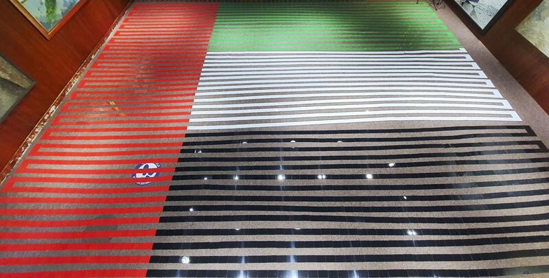 World's longest line of plastic cards, with 3,194 cards in the UAE flag colours. Photo courtesy: Ramkumar Sarangapani