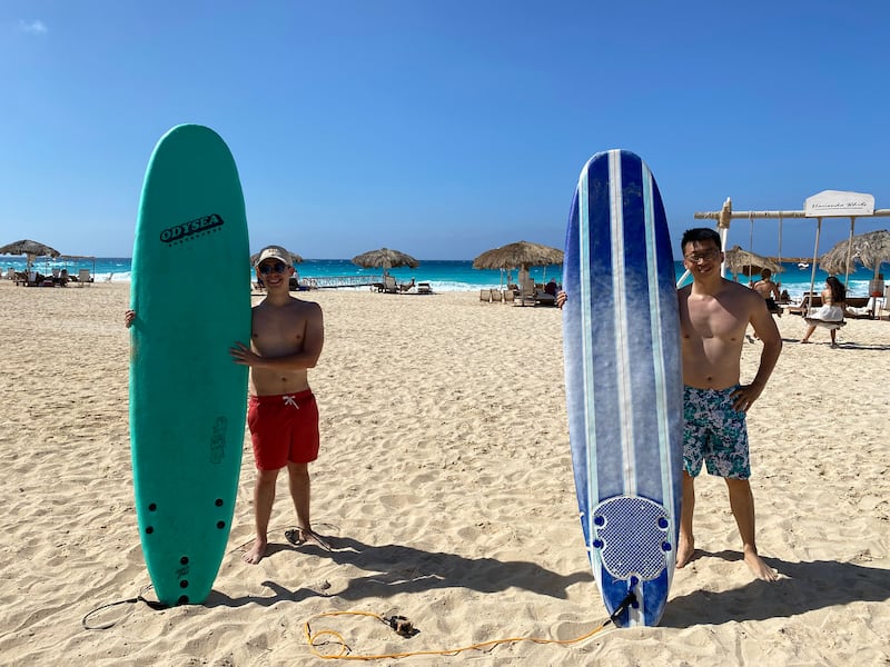 Work colleagues Thibaut and Lixue Wan tried surfing for the first time at Surf Camp Egypt. Nada El Sawy / The National