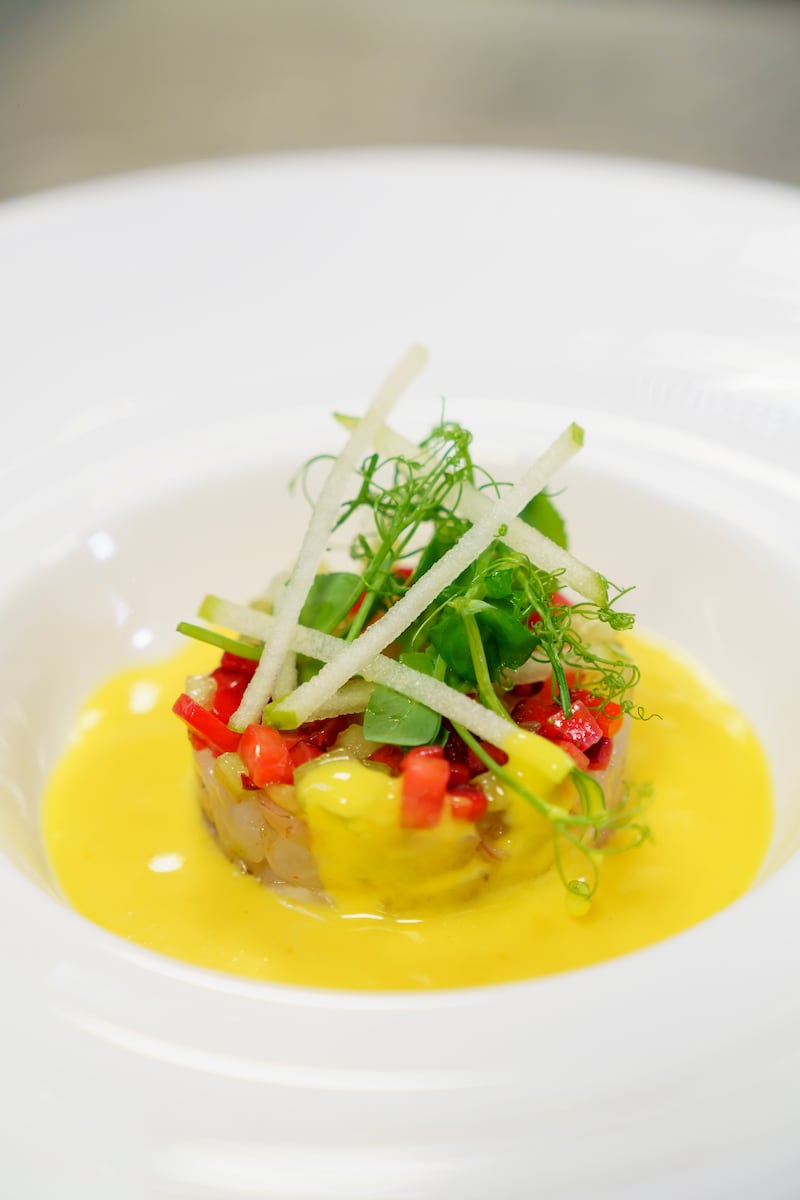 The tartare dish, made with sea bass, red prawns and a yellow cherry tomato coulis.