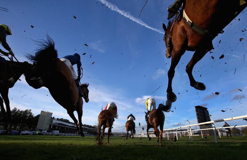 Horses and riders clear a fence during The Tanners Wines Handicap Steeple Chase at Ludlow Racecourse in Ludlow, England. Getty Images