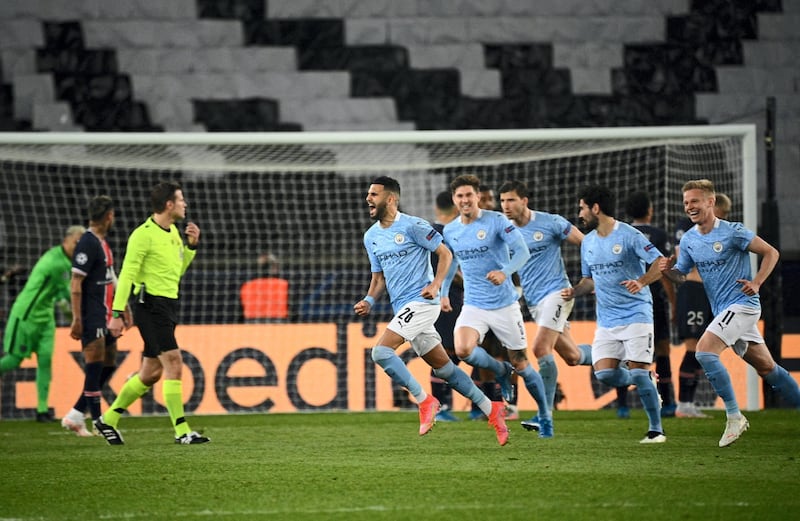 Manchester City's Algerian midfielder Riyad Mahrez celebrates after scoring a goal during the UEFA Champions League first leg semi-final football match between Paris Saint-Germain (PSG) and Manchester City at the Parc des Princes stadium in Paris on April 28, 2021. (Photo by Anne-Christine POUJOULAT / AFP)