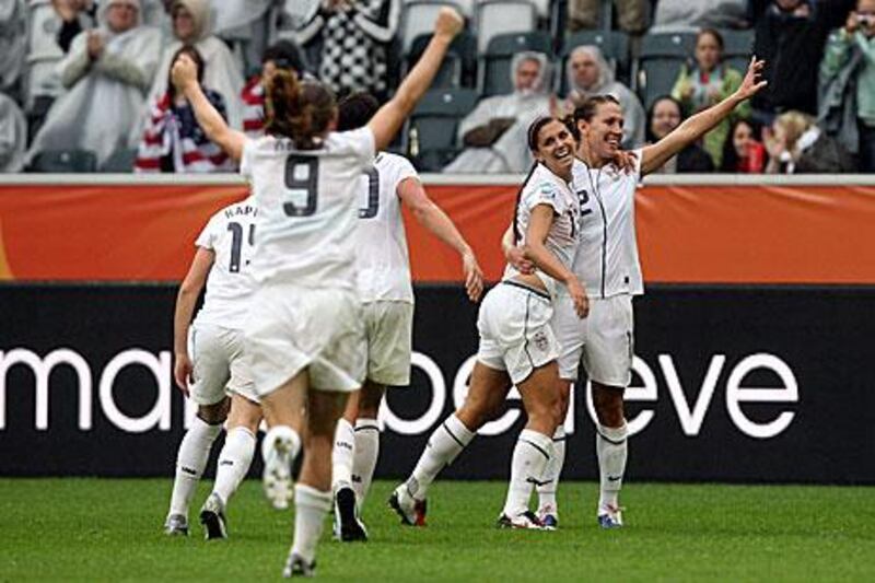 Alex Morgan (2nd from right) celebrates after she scores USA's third goal that sealed  France's fate.