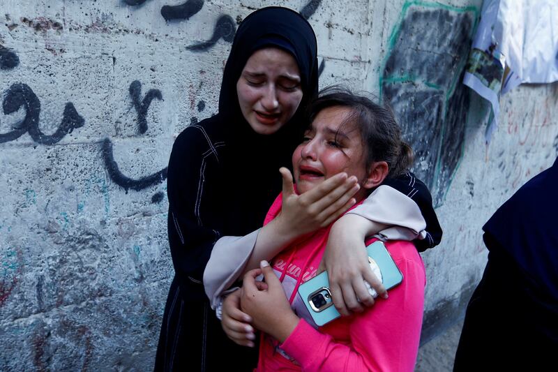 The daughter of  Zakaria Abu Maamar, a member of Hamas's political office, at her father's funeral, after he was killed in an air strike in Khan Younis. Reuters