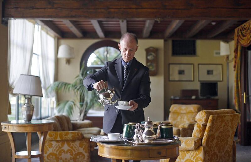Maurizio Tagliavia prepares tea at the Villa Del Quar. Max Rossi / Reuters
