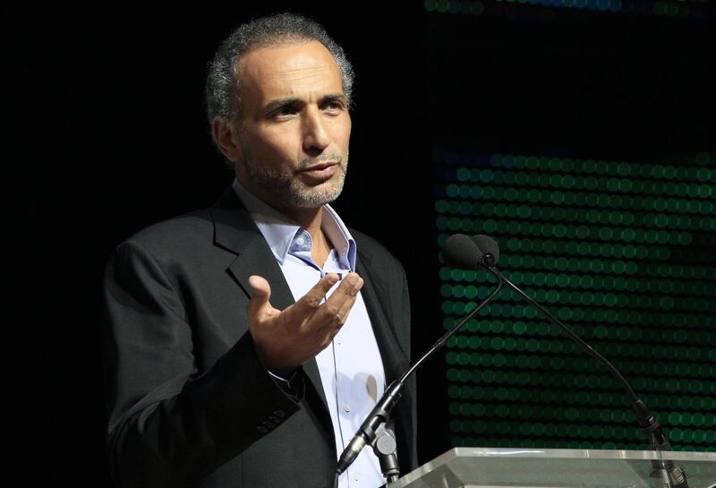 (FILES) In this file photo taken on April 07, 2012 shows Swiss Muslim intellectual and professor Tariq Ramadan speaking during a meeting focused on "Faith and Resistance, Reform and Expectancy" at the yearly meeting of French Muslims organized by the Union of Islamic Organisations of France (UOIF) in Le Bourget, outside Paris. Reformist scholar Ramadan, already charged with two counts of rape with a third rape accusation emerging in March of 2018, is facing a new complaint in France, for a rape that allegedly took place in 2014, and which could lead to further prosecution. / AFP / Jacques DEMARTHON
