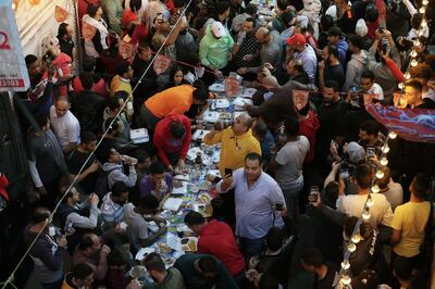 Residents of Ezbet Hamada in the Matareya district gather in the streets to eat Iftar, during the holy fasting month of Ramadan in Cairo, Egypt, 06 April 2023.  EPA 