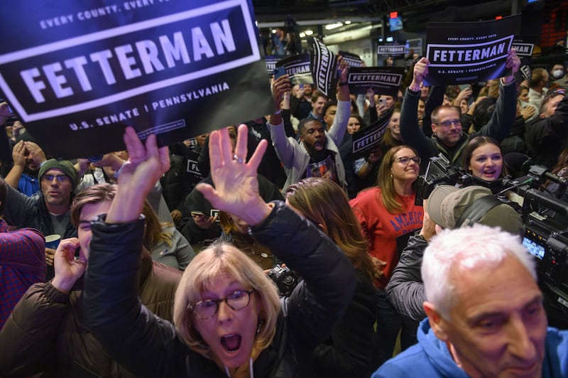 Supporters cheer during an election night event for Democratic Senate candidate John Fetterman in Pittsburgh, Pennsylvania.  Mr Fetterman defeated Republican Senate candidate Dr  Mehmet Oz.  AFP