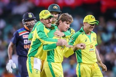 Australia's Adam Zampa (C) celebrates with teammates after dismissing India’s Shikhar Dhawan during the one-day international cricket match at the Sydney Cricket Ground (SCG) in Sydney on November 27, 2020. IMAGE RESTRICTED TO EDITORIAL USE - STRICTLY NO COMMERCIAL USE / AFP / DAVID GRAY / IMAGE RESTRICTED TO EDITORIAL USE - STRICTLY NO COMMERCIAL USE
