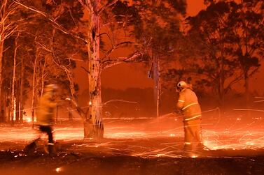 Thousands of holidaymakers and locals were forced to flee to beaches in fire-ravaged south-east Australia on Tuesday. AFP