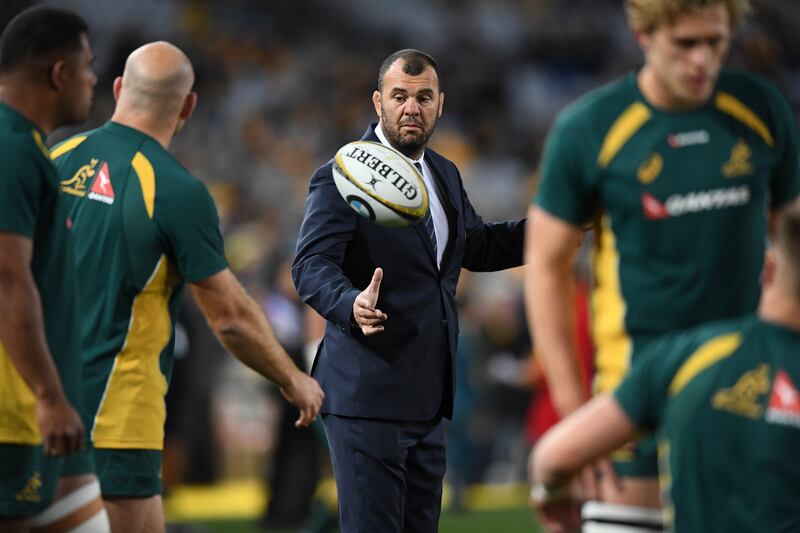 epa06151046 Australia head coach Michael Cheika (C) catches a ball as he watches his players warm up before game 1 of the Bledisloe Cup between the Australian Wallabies and the New Zealand All Blacks at ANZ Stadium in Sydney, Australia, 19 August 2017.  EPA/DAVID MOIR  AUSTRALIA AND NEW ZEALAND OUT