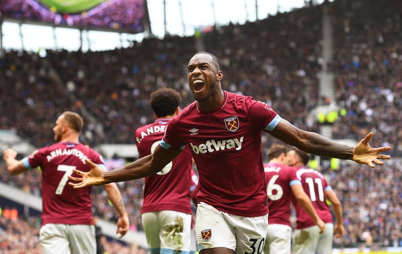 epaselect epa07531918 West Ham's Michail Antonio (R) celebrates after scoring the 1-0 lead during the English Premier League soccer match between Tottenham Hotspur and West Ham United at the Tottenham Hotspur Stadium in London, Britain, 27 April 2019.  EPA/ANDY RAIN EDITORIAL USE ONLY. No use with unauthorized audio, video, data, fixture lists, club/league logos or 'live' services. Online in-match use limited to 120 images, no video emulation. No use in betting, games or single club/league/player publications.