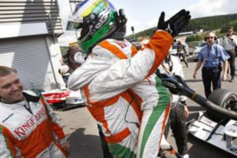 Giancarlo Fisichella celebrates his second-place finish on Sunday with his Force India team.