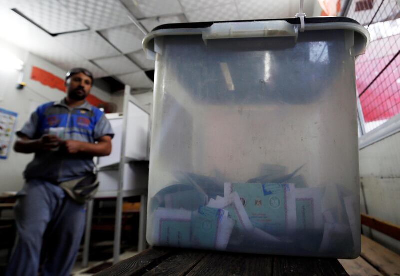 A man casts his ballot at a school used as a polling station, during the first round of Egypt's parliamentary elections in Giza. Reuters