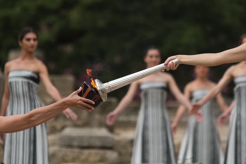The Olympic torch will arrive at the Opening Ceremony in Paris on 26 July. EPA