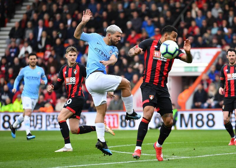 Aguero in action with Bournemouth's Joshua King. Reuters