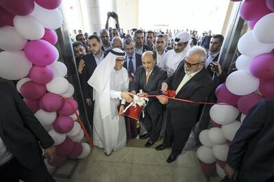 GAZA CITY, GAZA - SEPTEMBER 16 : Mohamed Al-Emadi (L), Chairman of Qatars Committee for the Reconstruction of Gaza along with Palestinian officials cut the ribbon during the opening of Palace of Justice complex in Al-Zahra town in Gaza City, Gaza on September 16, 2018. (Photo by Mustafa Hassona/Anadolu Agency/Getty Images)